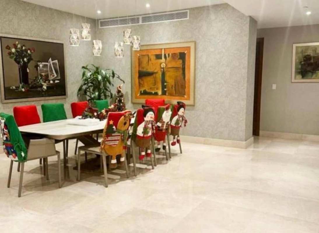 Cozy family room or den with modern furnishings and TV wall in The Crescent Santa María Panama