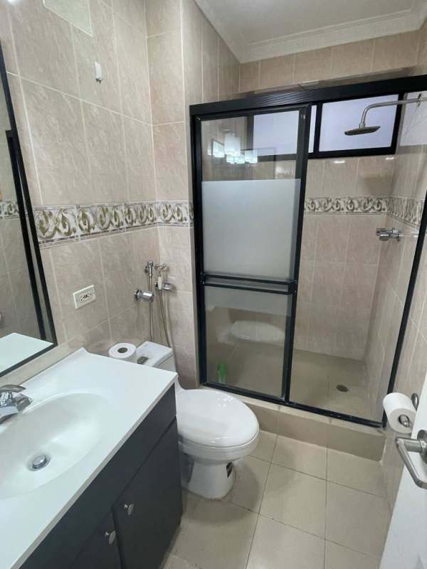 Modern kitchen with granite counters, striped wall, stainless appliances in PH Paitilla Premium