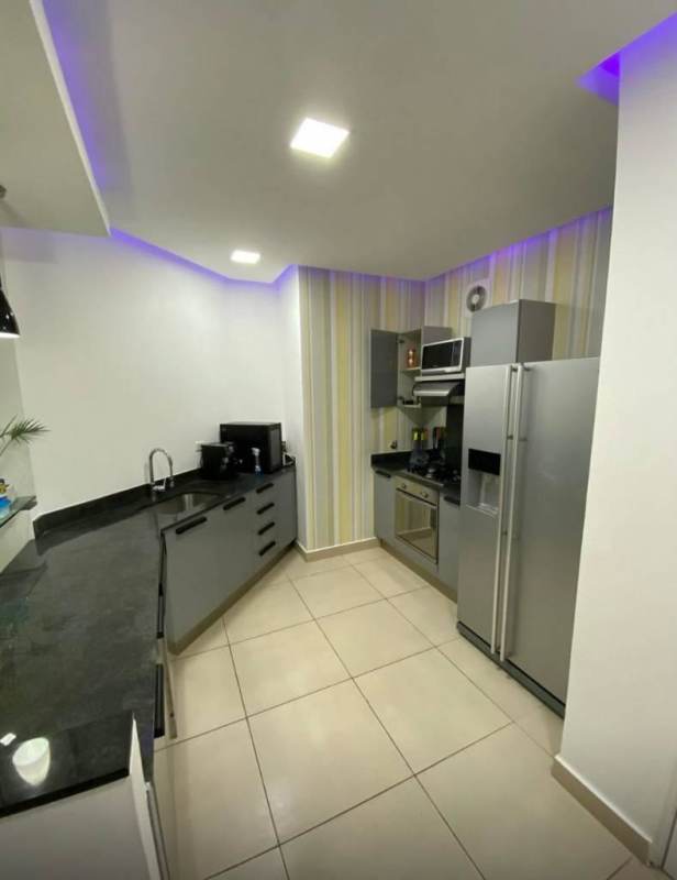 Bedroom with built-in closet, AC unit, and city skyline view Punta Paitilla