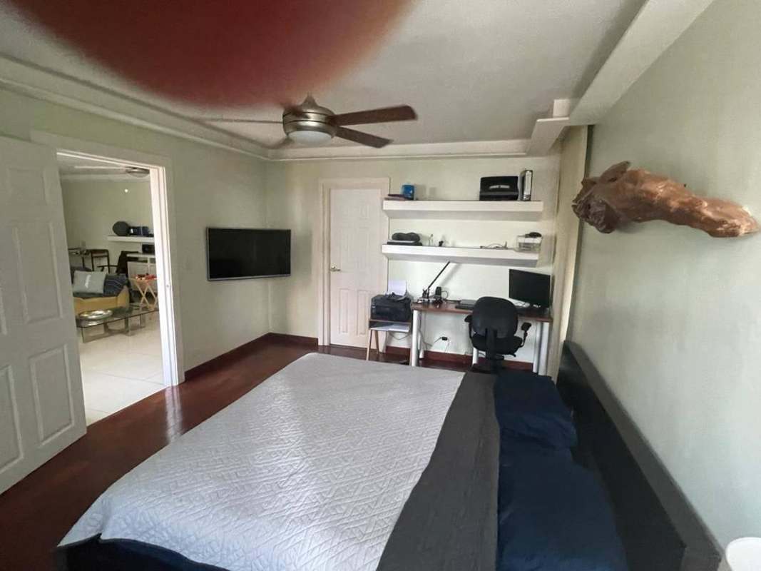 Walk-in closet with built-in cabinetry in master bedroom PH Paitilla Premium