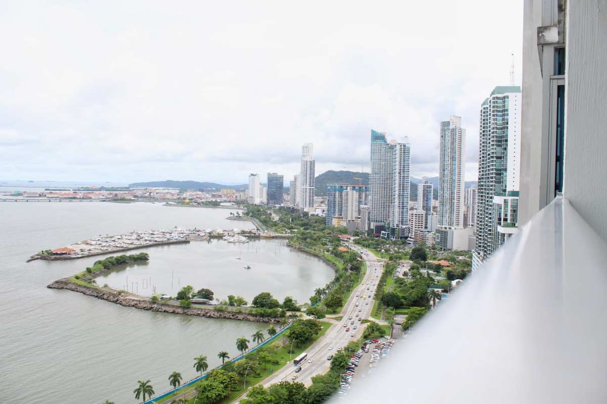 Duplex apartment balcony with panoramic Pacific Ocean marina skyline views in PH BICSA Financial Center Panama City