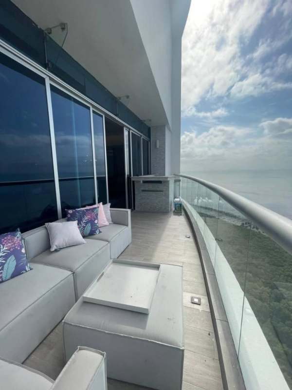 Master bedroom with ocean view, ensuite bath, and panoramic windows in PH Pearl Costa del Este Panama