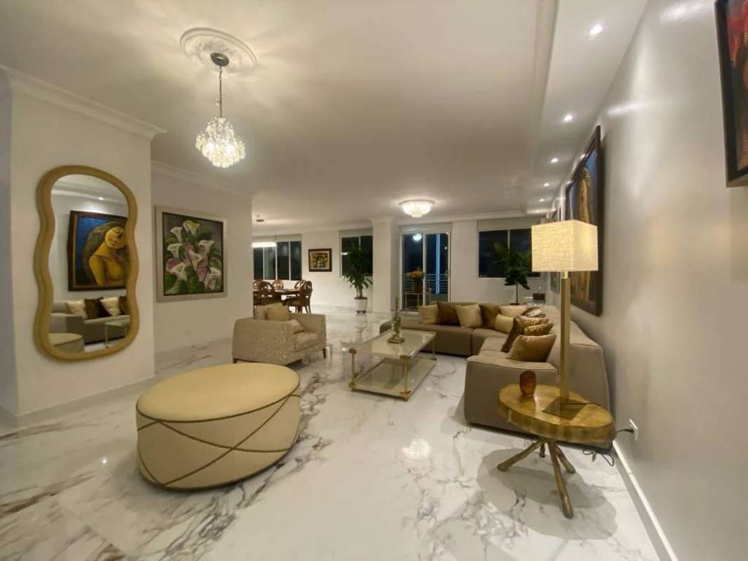 Second living space with polished marble floors and large sofa PH Sunrise Tower Obarrio Panama for rent