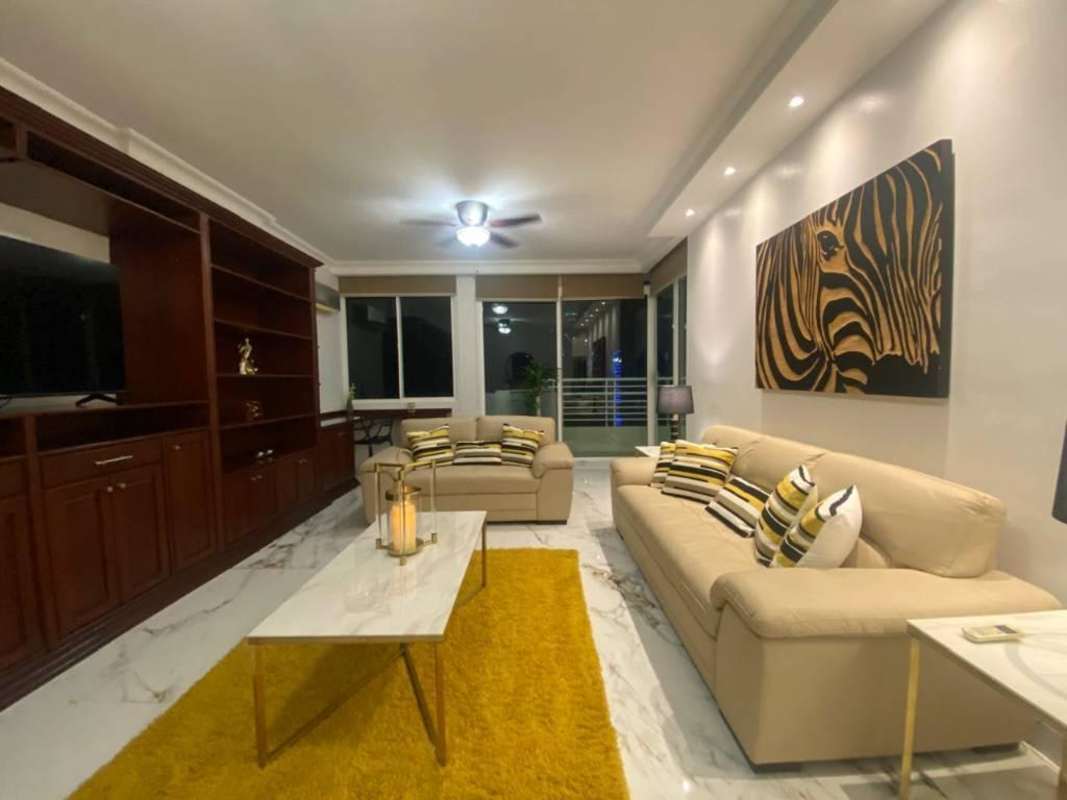 Spacious dining room with marble floors, chandelier, elegant decor in PH Sunrise Tower Obarrio Panama