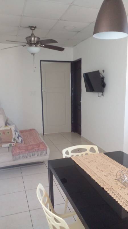 Living area with TV, tile flooring, ceiling fan Paseo del Valle Villa Lucre apartment