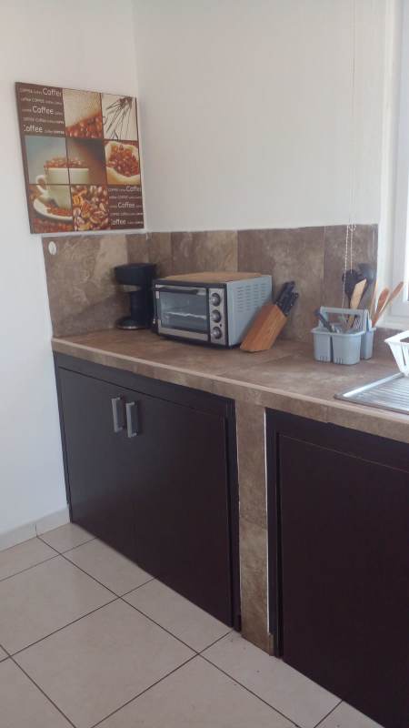 Modern small kitchen with marble counters, small appliances Villa Lucre Panama rental