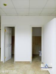 Interior stairs and corridor in a business center in David Chiriquí Panama, with handrail and fluorescent lighting