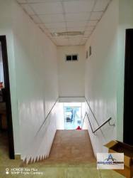 Bright workspace with large windows, flooring, and storage space in Central David commercial zone