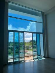 Modern kitchen with cabinets and granite style counters at Royal Palm condo Panama