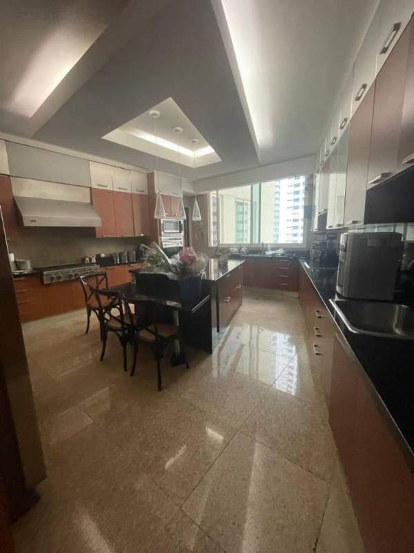 Formal dining room with modern chandelier and ocean view Ocean Reef Towers Punta Pacifica Panama