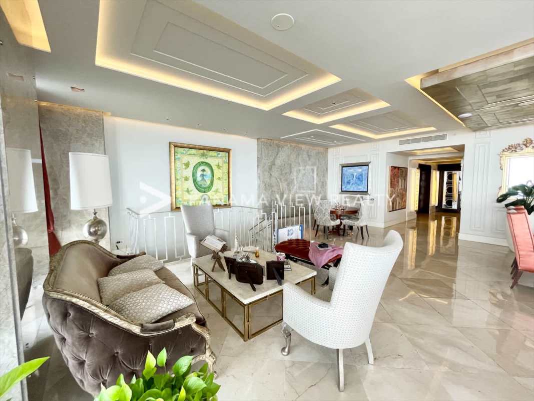 Open design living room with high ceilings, marble floors, panoramic ocean views at PH The Point