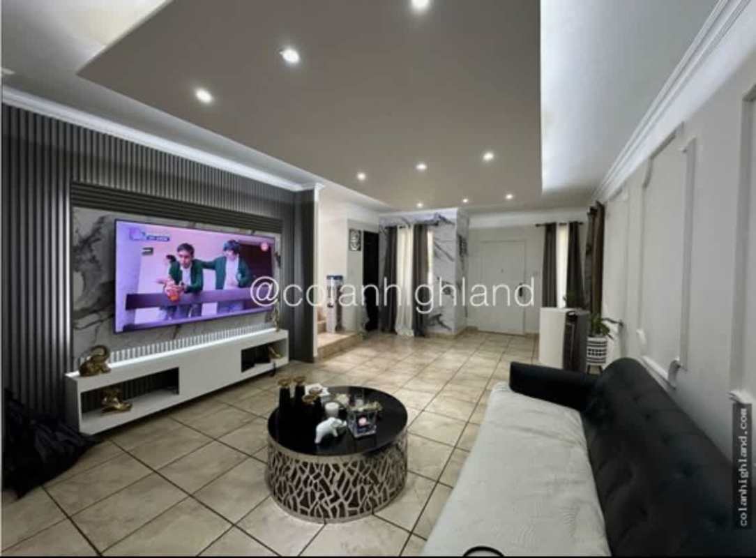 Two-story house exterior with attached garage and driveway at PH Everest Brisas del Golf Panama