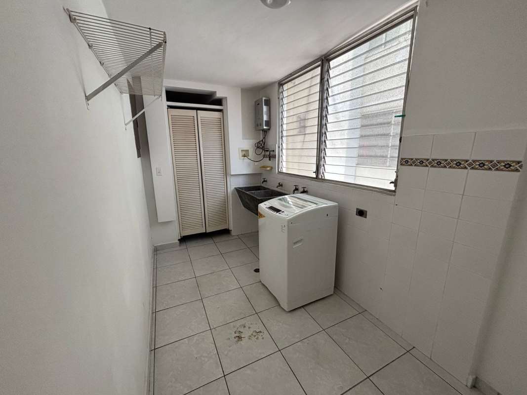 Laundry room with utility sink washing machine large windows in PH Via Porras Panama
