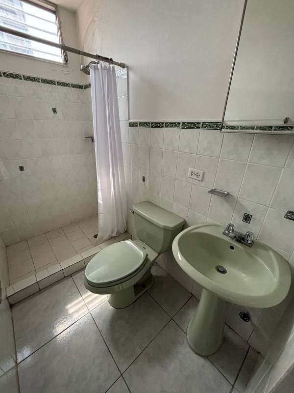 Bedroom with ceramic floor, large window, ceiling fan and split AC in PH Via Porras San Francisco Panama