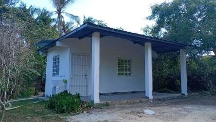 Budget rental exterior covered porch with secure entry and garden Gorgona Panama