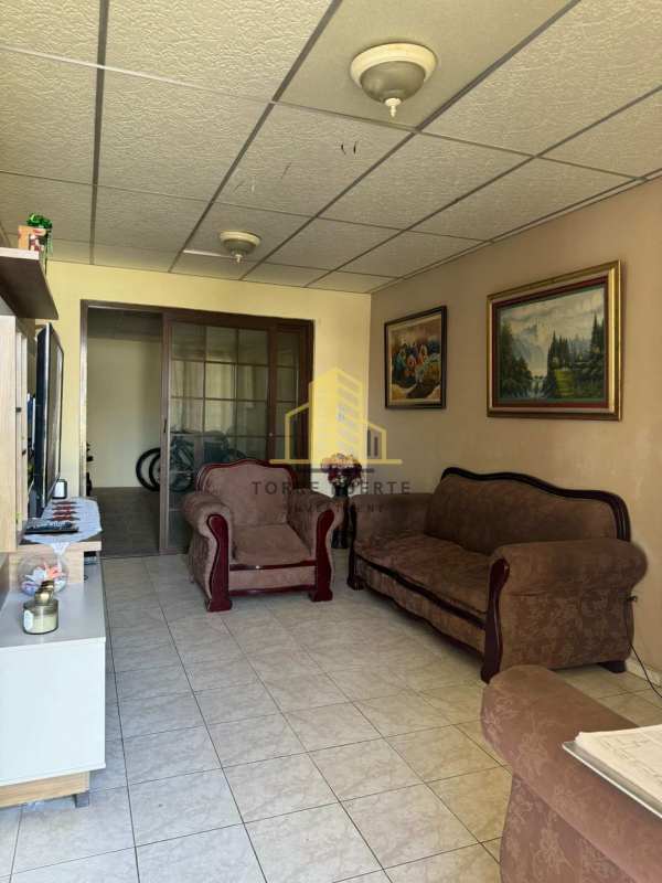 Bedroom with tiled floor and bed Don Bosco Costa Sur Panama house for sale