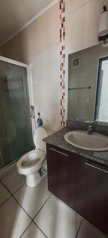 Bedroom with white closets, ensuite bathroom view, tile floor in PH Parque Lefevre Panama