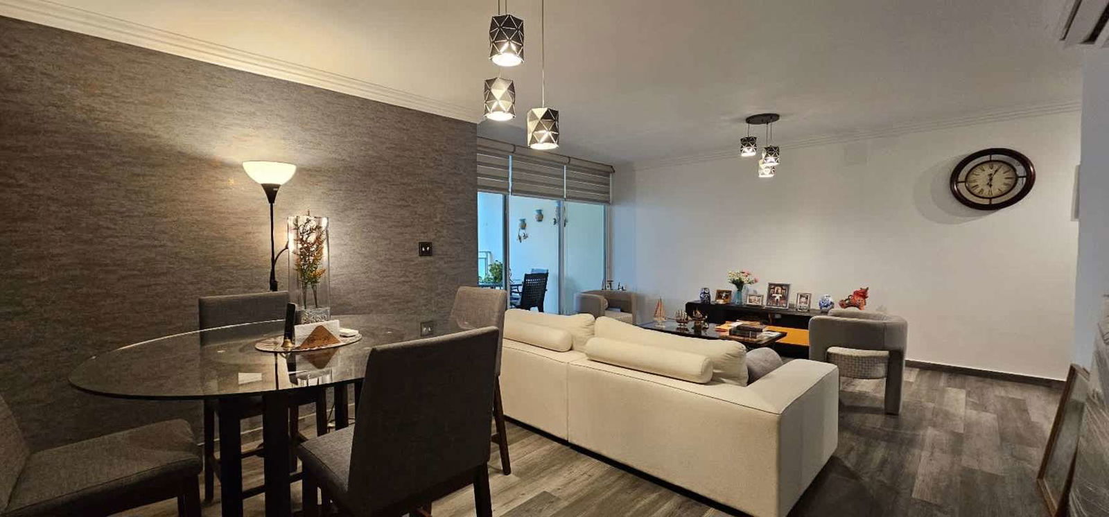 Modern kitchen with granite countertops and wood cabinetry in PH Royal Pacific Punta Pacifica