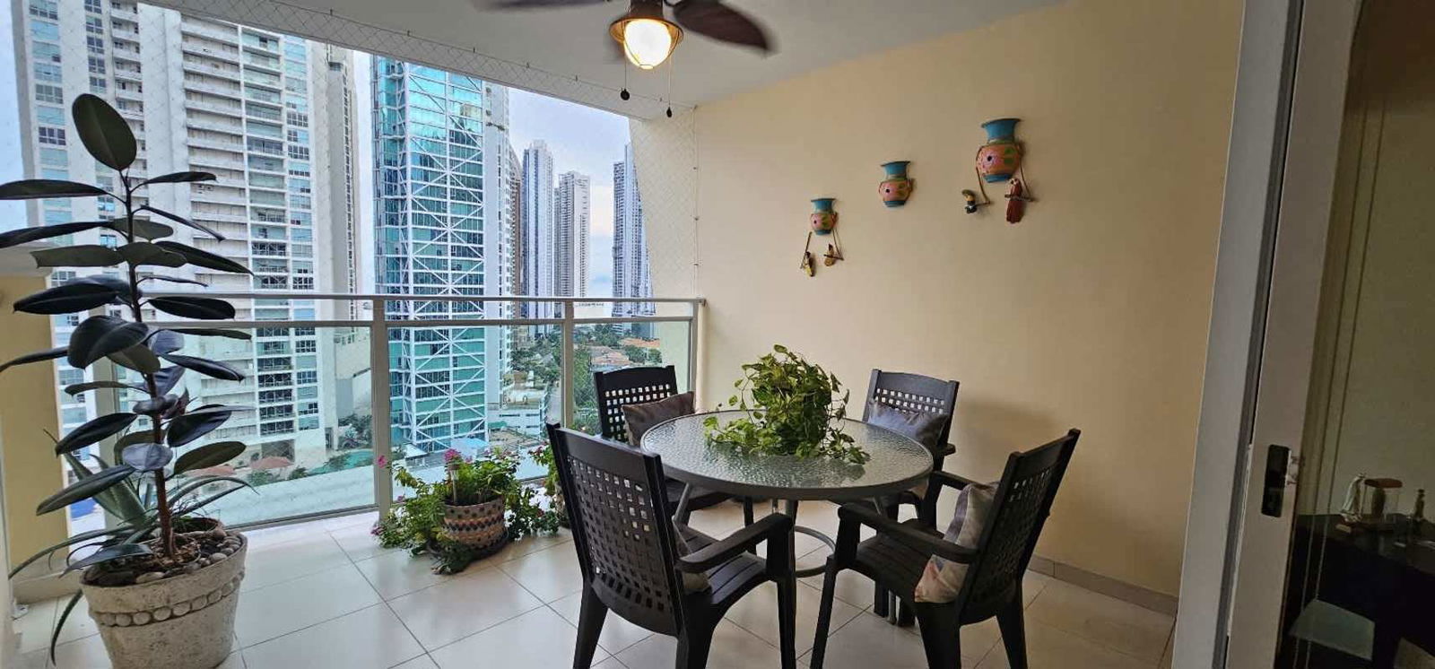 Spacious master bedroom with panoramic ocean view and city skyline in PH Royal Pacific