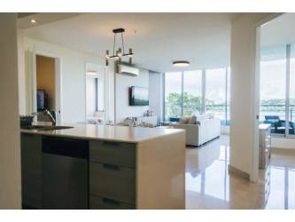 Furnished bedroom with ocean views from window PH Casa Bonita Veracruz Panama