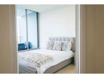 Modern living room with balcony access and ocean view in PH Casa Bonita Veracruz Panama