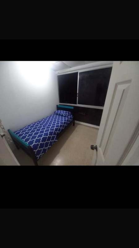 Small bedroom with large window single bed Villa Las Fuentes Panama