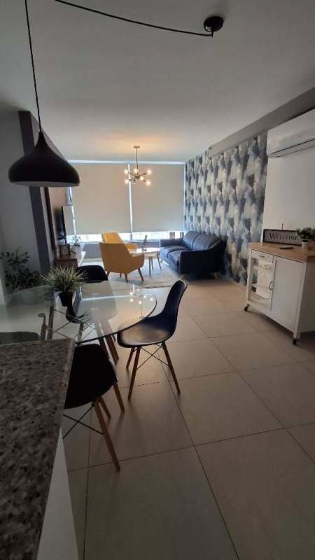 Open concept living dining area with balcony furnished apartment PH Carrasquilla Park Tower San Francisco Panama