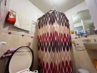 Open kitchen with granite countertops and breakfast bar in affordable house Costa Verde Panama