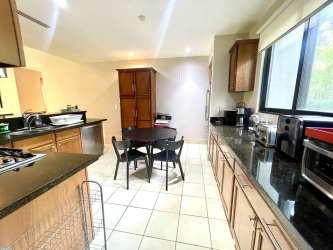 Family-friendly bedroom with bunk bed and queen bed in Paseo de las Casas Buenaventura