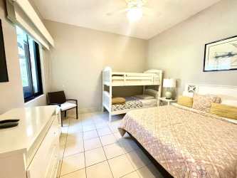 Modern open living room with sliding glass doors to patio at Buenaventura Paseo de las Casas