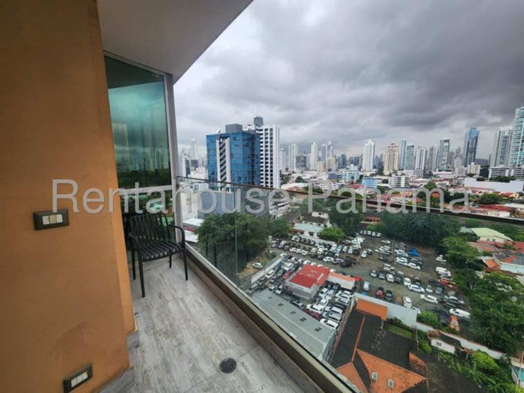 Cozy master bedroom with balcony access and ocean view in Coco del Mar apartment Panama