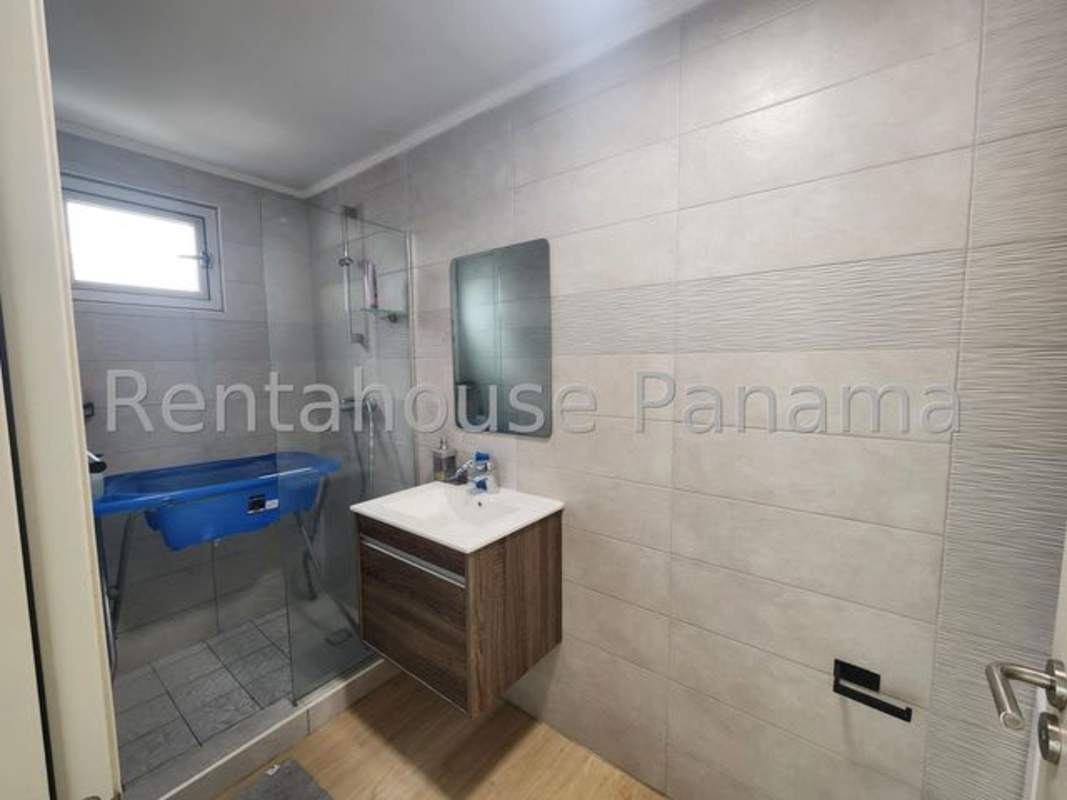 Luxury building pool with ocean backdrop in Coco del Mar at Quartier del Mar Panama