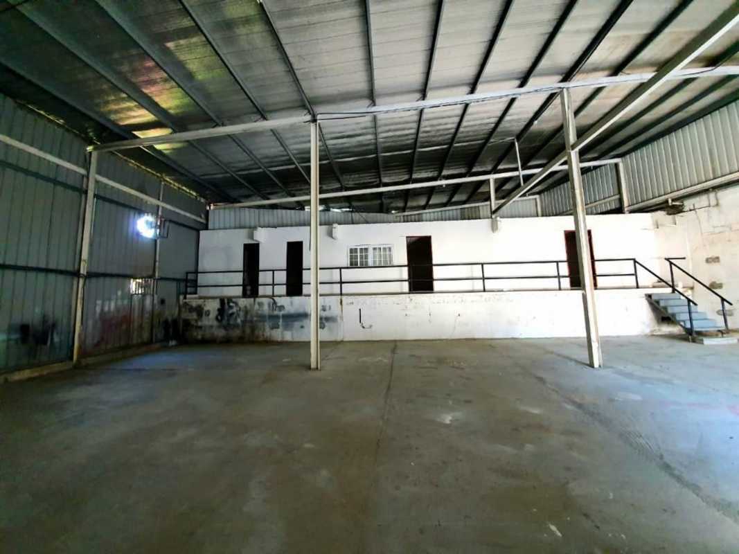 Interior of warehouse showing elevated loading dock, metal walls and mezzanine option