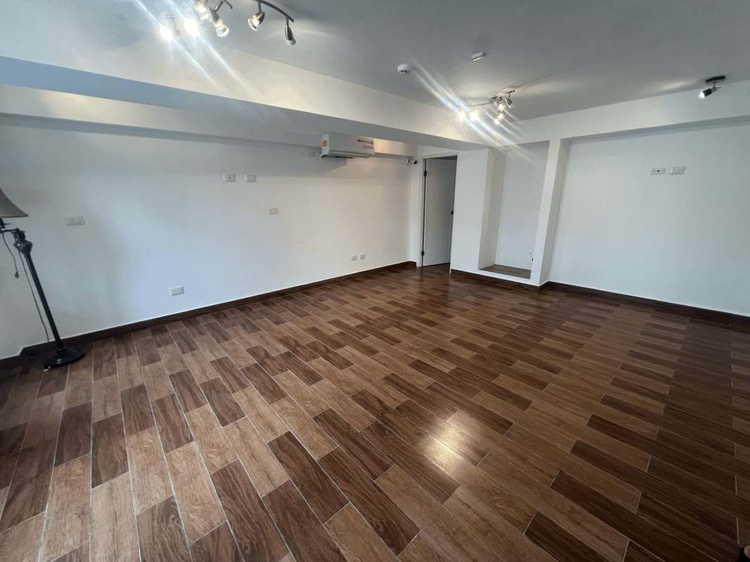 Contemporary kitchen with island, granite countertops and stainless appliances in Altos del Golf Panama