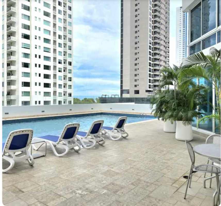 Infinity rooftop pool with lounge chairs city views PH Castellammare Panama