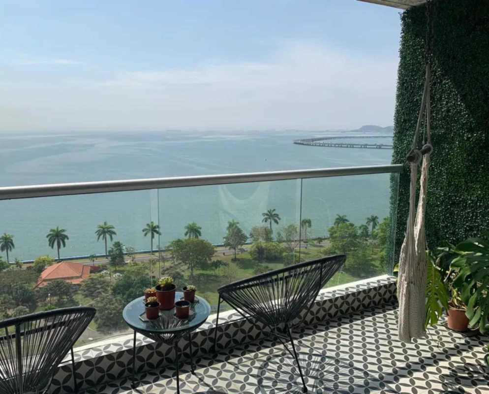 Modern kitchen with custom cabinetry and stainless steel appliances in PH Rivage Tower Panama City