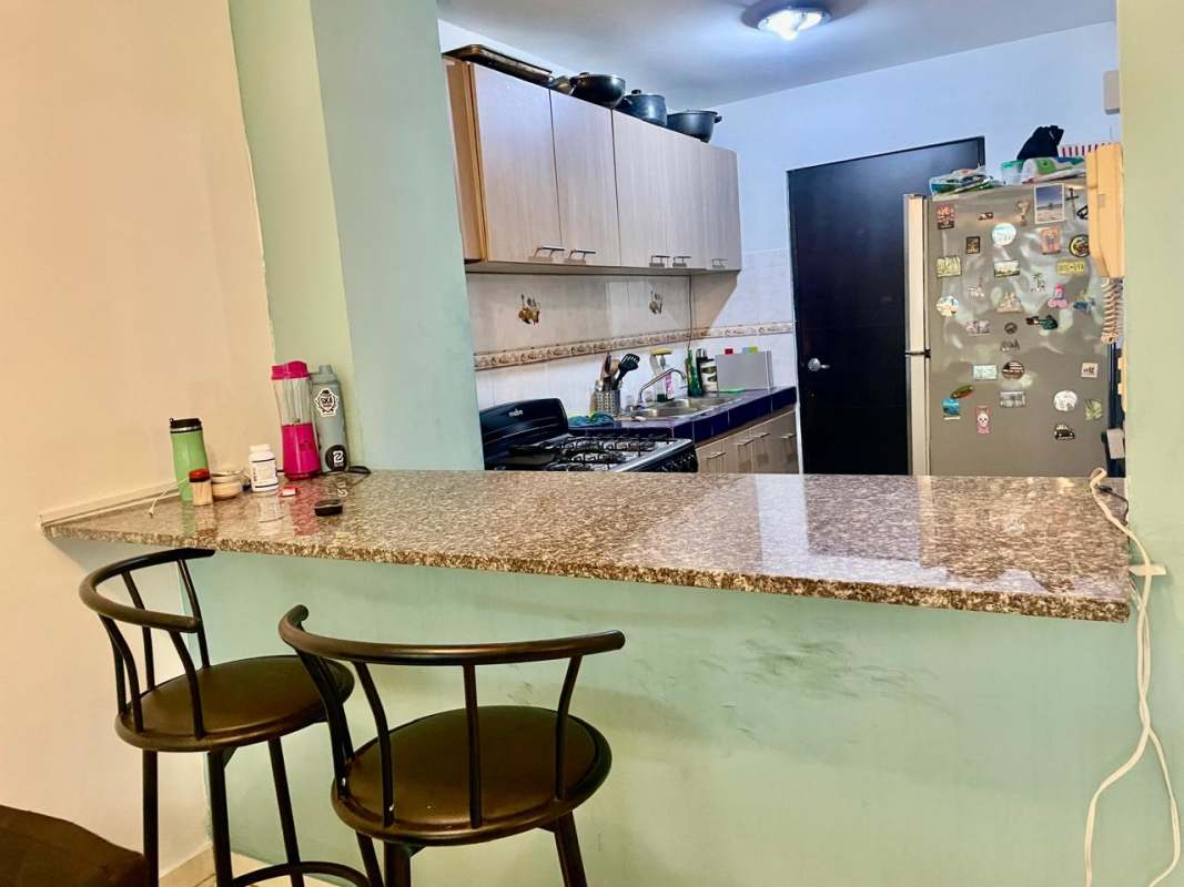 Apartment kitchen granite breakfast bar gas stove PH Villa del Sol Panama