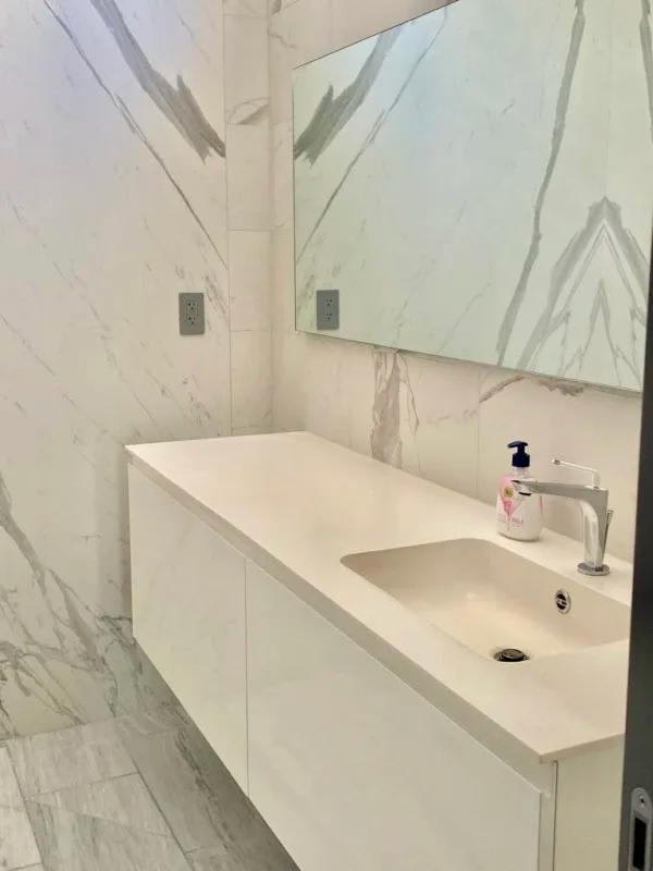 Elegant marble bathroom with glass shower in PH Nuovo by Armani Casa, Bella Vista, Panama City