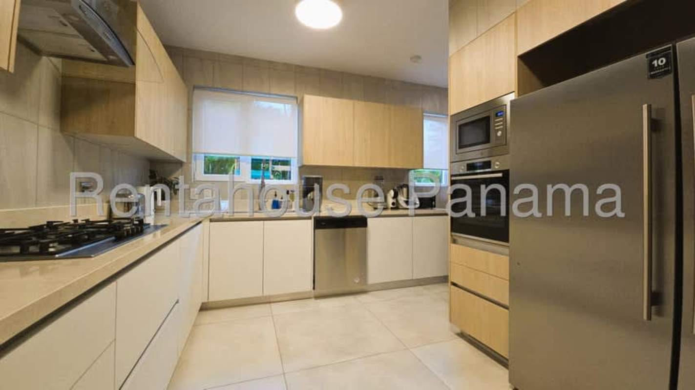 Modern bathroom with glass shower and elegant fixtures in The Woods Santa Maria Panama home