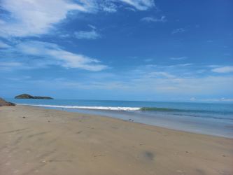 Sandy coastline and calm Pacific waves near Rio Hato land for sale Panama