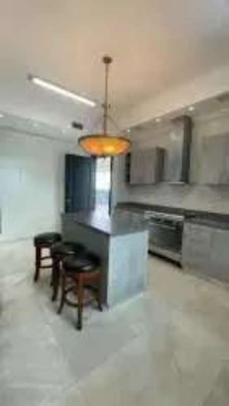 Contemporary spacious kitchen with island stainless steel appliances Ocean Two Costa del Este Panama