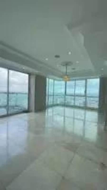 Modern bathroom with Jacuzzi and ocean view through full-height windows in PH Ocean Two Panama City