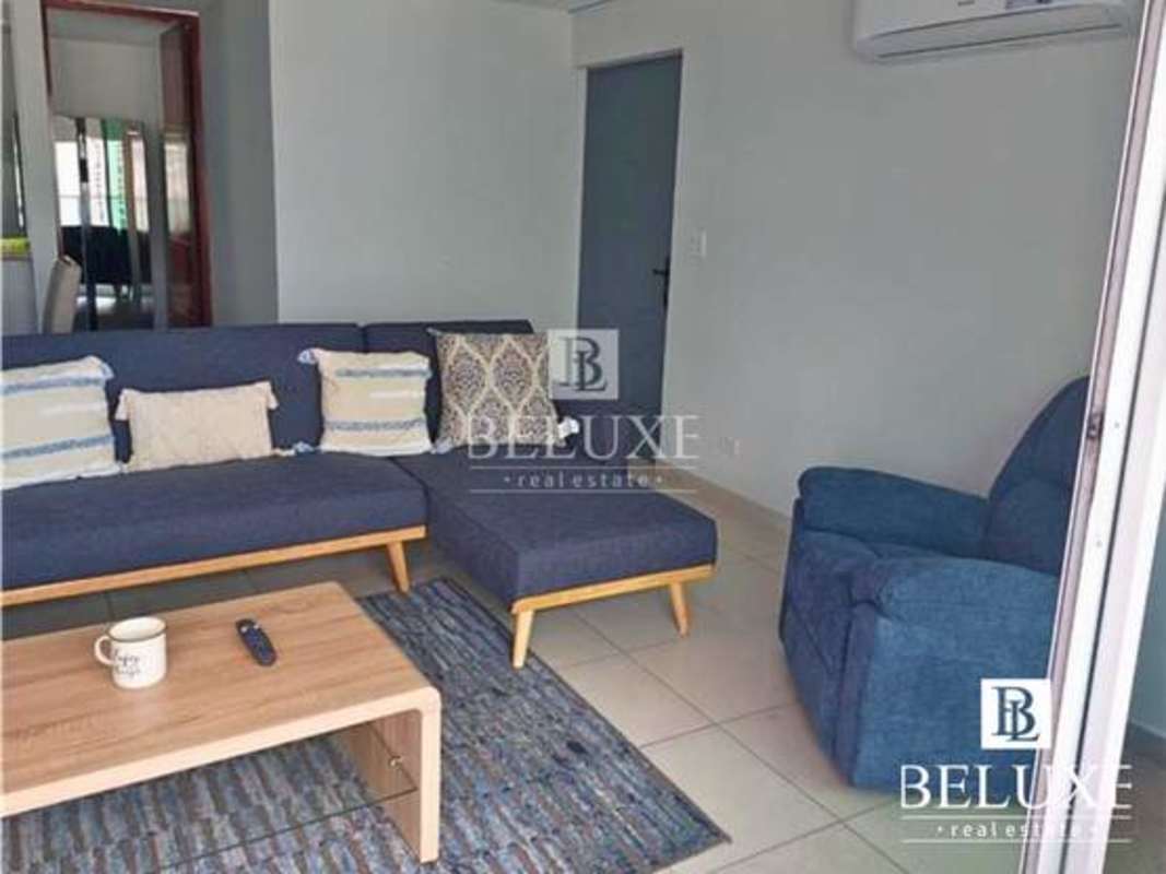 Modern kitchen with wood cabinets granite countertops PH Terramar San Francisco Panama