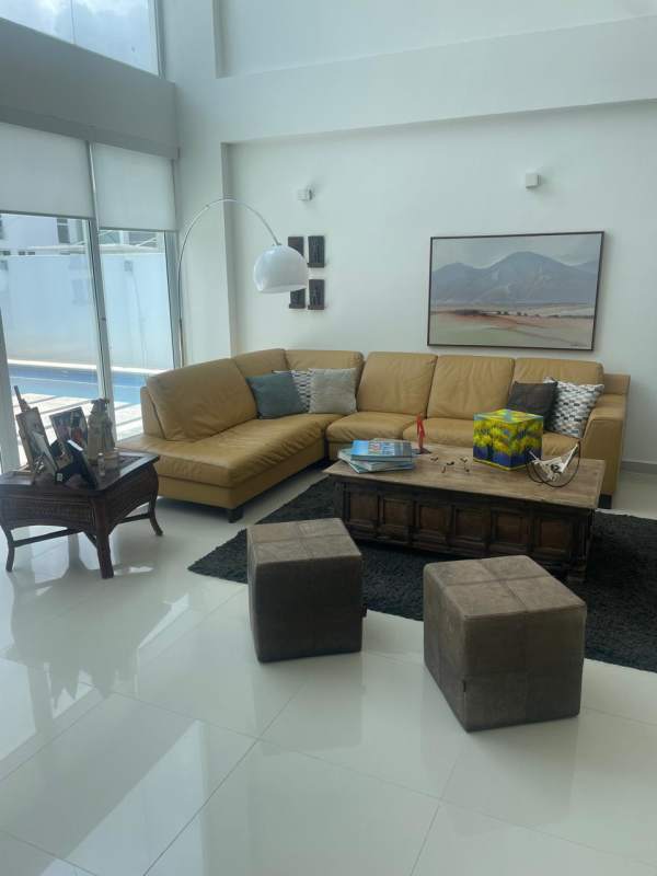 Modern covered patio with dining area and tropical landscaping in Costa Esmeralda Costa Sur Panama