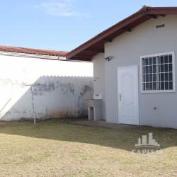 Side yard with outdoor sink and access to backyard at house in Brisas del Golf Arraiján Panama