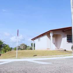 Large fenced backyard with grass in single-family home Brisas del Golf Panama