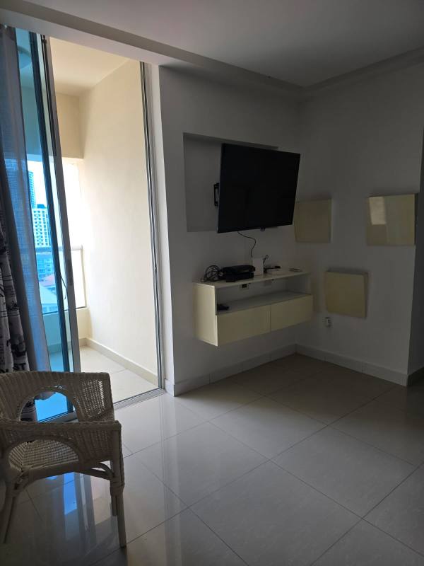 Open living room and dining with ceramic tile floors, balcony view for rent at PH Diamond Tower Panama