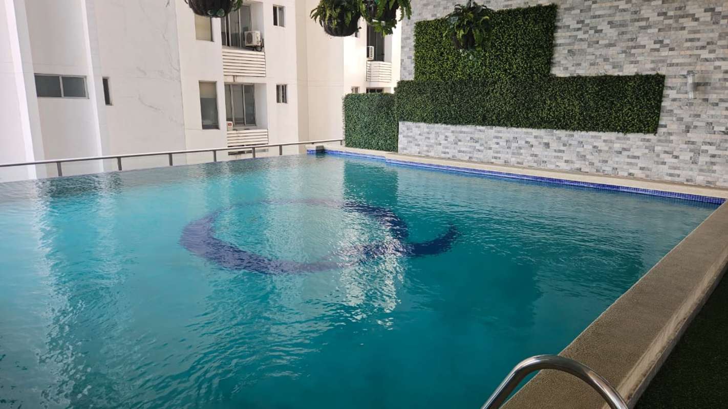 Modern condominium gym with machines and city views in PH Quartier 74 Panama City