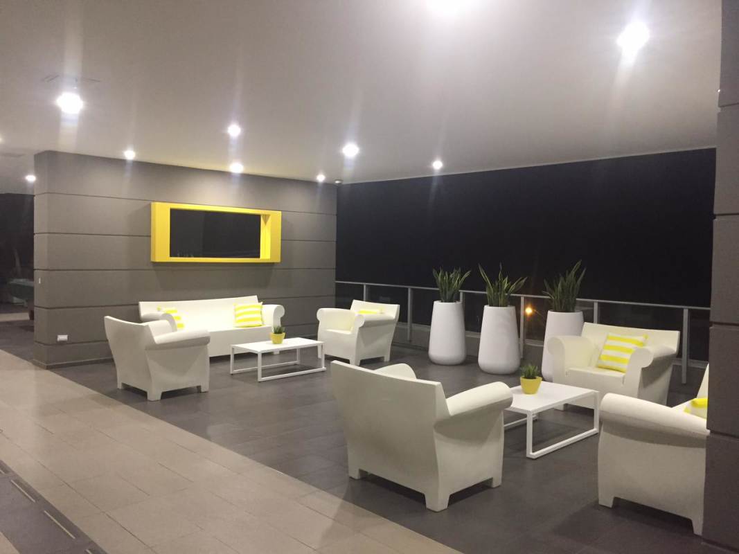 Contemporary resident lounge with yellow accents PH Altamar Costa del Este Panama City