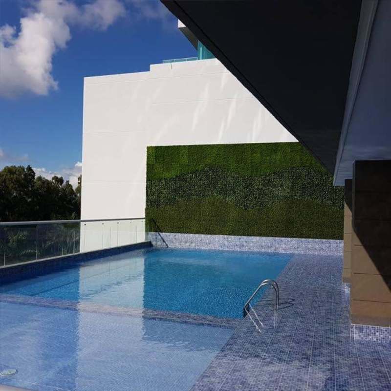 Luxury infinity pool and outdoor lounge at PH Altamar with ocean and city views Costa del Este